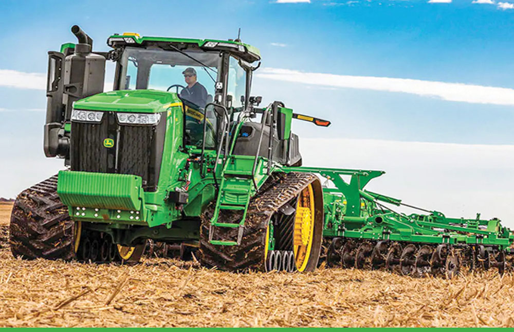 John Deere 9 series tracked tractor tilling field